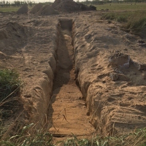 Long soft-dig trench in sandy soil