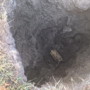 Buried utility line in a pit that was excavated