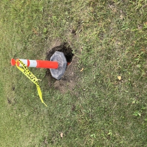 Safety pylon in a hole excavated for Swift